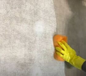 unleash your rv s beauty learn how to paint rv walls like a pro, Washing the interior RV walls with a sponge wearing a protective glove