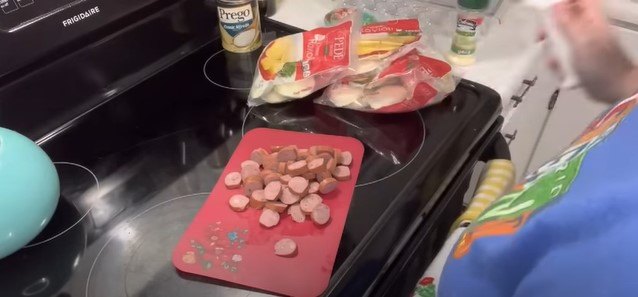 how to make low budget dollar tree meals with just 9, Cutting up the sausage