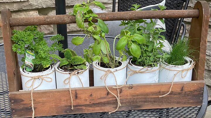patio makeover on a budget, Growing herbs in old paint cans