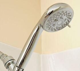 how to deep clean your entire home in just one week, Make sure you don t forget to clean the showerhead when you re going over your bathroom