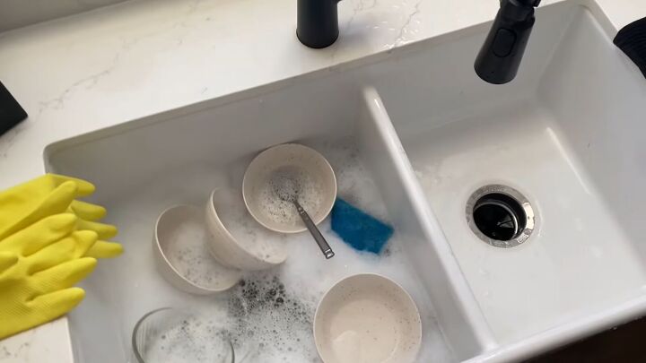 how to save money during the summer, Hand washing dishes in the sink