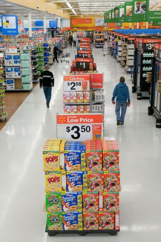 top 10 things to buy at walmart in 2023, Walmart isle with shoppers