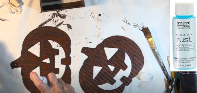 Painting the pumpkins to look rusty