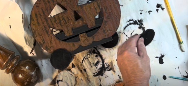 Attaching the rounds to the metal pumpkin