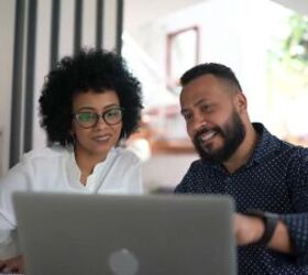 frugal partner, Couple looking at finances on laptop