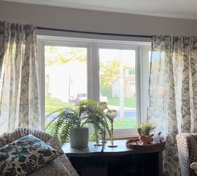 unbelievable living room transformation using only thrift store finds, Putting curtains up