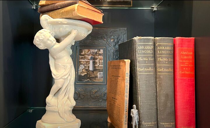 dark academia decor ideas, Statuette with stacked books