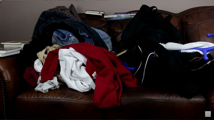 Laundry piled on sofa