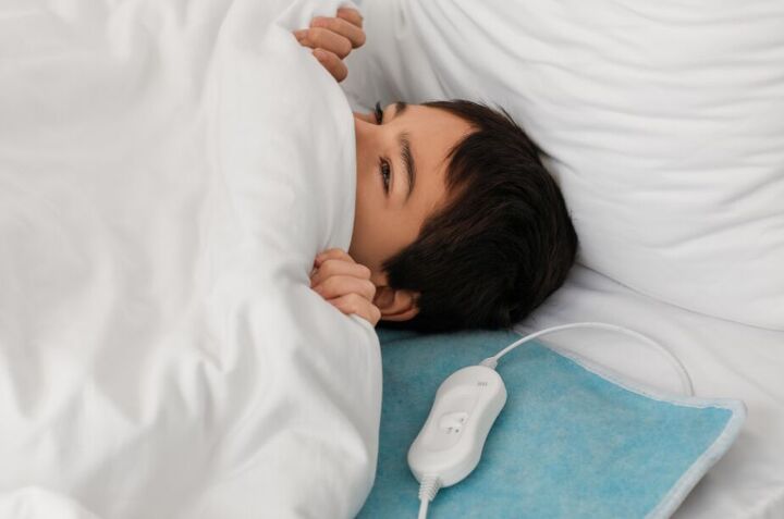 how to save money in 2024, Child with heated blanket