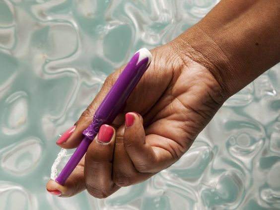 10 surprising and creative uses for tampons wow, Woman holding a tampon