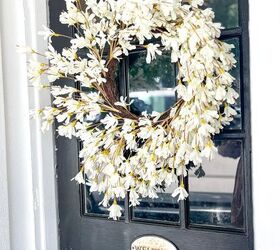 31 easy ideas to decorate a patio or porch for summer, white forsythia wreath hung on the front door