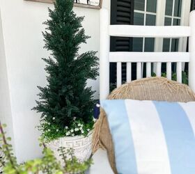 31 easy ideas to decorate a patio or porch for summer, view of beautiful outdoor topiaries on either side of the front doors