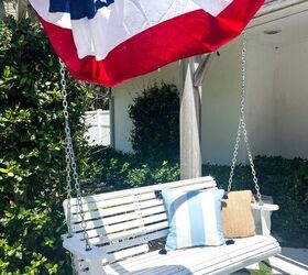 31 easy ideas to decorate a patio or porch for summer, white porch swing with summer pillows on it