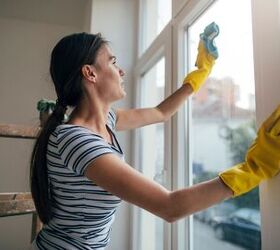 Woman cleaning the windows - image via Canva