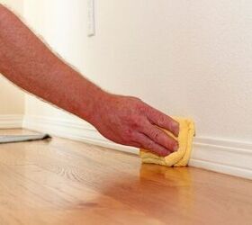 Cleaning baseboard by hand